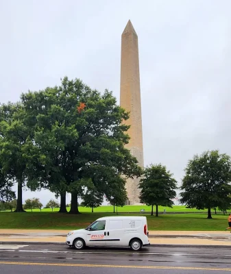 A Presto Pest Control service vehicle in the Washington Monument